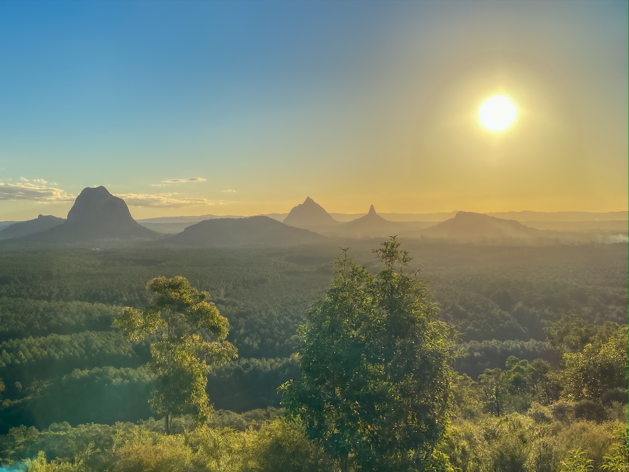 Sunrise over the Glass House Mountains from the Sunshine Coast hinterland
